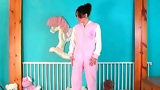 Chubby chick in diapers fooling around..