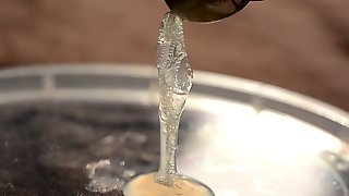 Emptying a fresh condom close-up