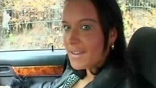 Brunette strips in car
