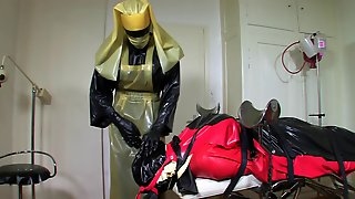 Bizarre rubber apron bondage 4 of 5